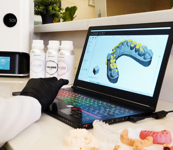 Alpha 3D slicing software with a model, with Curo resins and Ackuretta SOL in the background